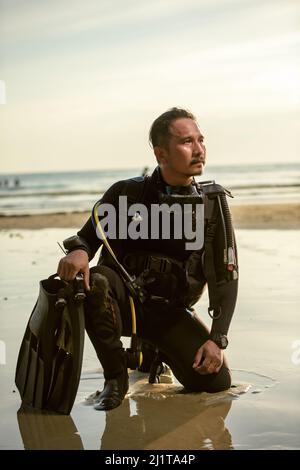 diver rescue in wetsui  equipment for scuba diving. The concept of sports, recreation, travel. Stock Photo