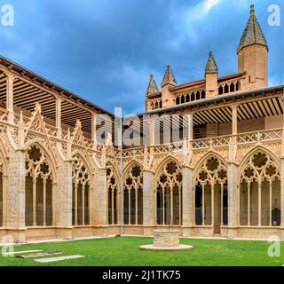Pamplona, Spain - June 21 2021: Ornate gothic cloister arcade arches of the Catholic Catedral de Santa Maria la Real, 15th Century Gothic Cathedral Stock Photo