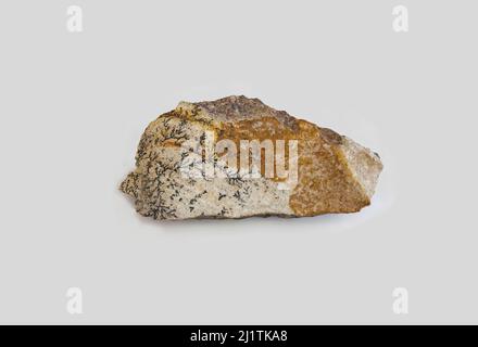 Pyrolusite amber fragment. Selective focus. Isolated over white background Stock Photo
