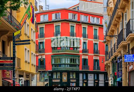 Pamplona, Spain - June 21, 2021: Colorful house facades and ornate metal balconies in the old town or Casco Viejo famous for running of the bulls Stock Photo