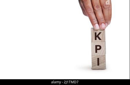 Banner KPI concept with wooden block on blue background. Key Performance Indicator using Business Intelligence metrics to measure achievement versus p Stock Photo