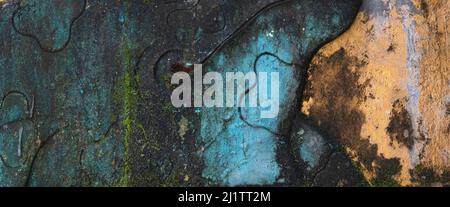 Aged and colorful abstract design on concrete wall texture in dark grungy space.Artistic background image. Stock Photo