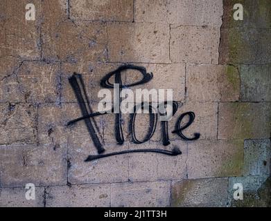 Distressed concrete wall in Indonesia with the word HOPE spray painted over it. Copy space Stock Photo