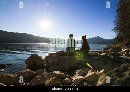 Couple goals at an Mountain Lake in the bavarian alps with the Standup paddles Stock Photo