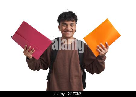 Young peruvian student showing folders to the camera and smiling, isolated. Stock Photo