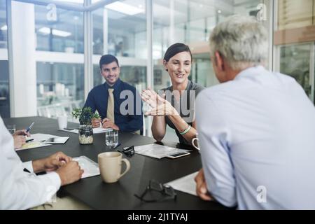 White collar business. Shot of corporate businesspeople in the office. Stock Photo
