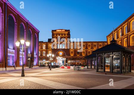 Lodz, Poland - August 6, 2020:  Manufaktura shopping mall and leisure complex with view to Cinema City in the evening. Stock Photo