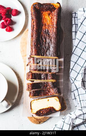 Homemade rectangular San Sebastian burnt cheesecake for breakfast, top view. Stock Photo