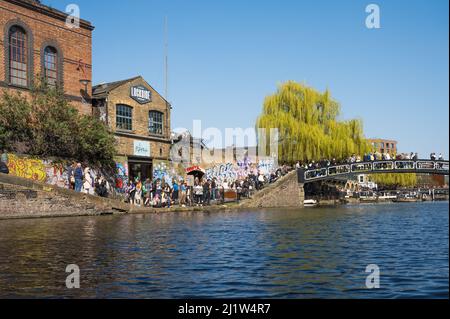 Crowds of people out and about on a sunny spring day at Camden Locks. London, England, UK. Stock Photo