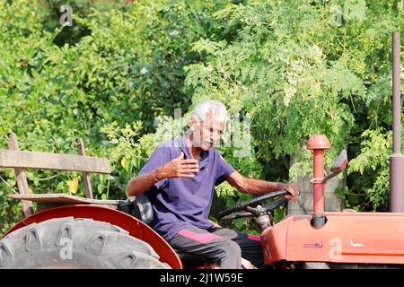 1 Indian Farmer Driving Tractor Stock Photo - Alamy