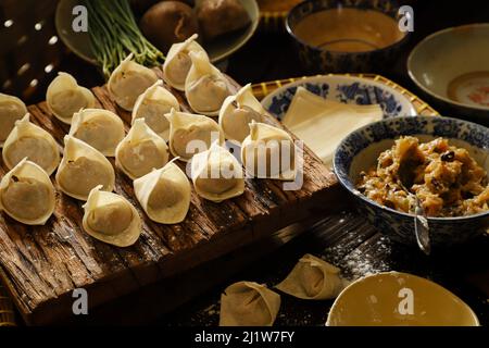 Freshly Made Wontons on Kitchen Countertop Stock Photo