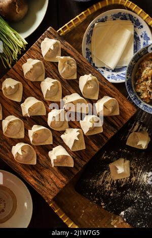 Freshly Made Wontons on Kitchen Countertop Stock Photo