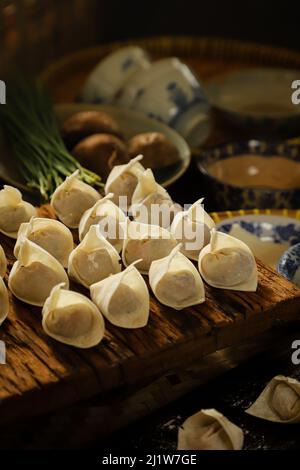 Freshly Made Wontons on Kitchen Countertop Stock Photo