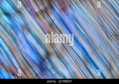 Closeup of uneven surface of stone with colorful pattern and cracks as textured background Stock Photo