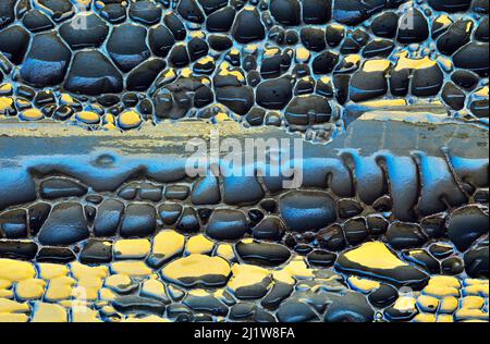 From above abstract background of stones of different shapes and sizes on wet ground on rainy day Stock Photo