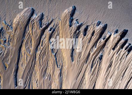 Top view of textured surface of rocky ground covered with dirt as abstract background Stock Photo