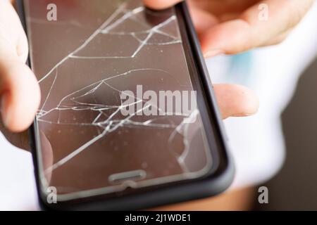 Broken protective film on a smartphone display Stock Photo
