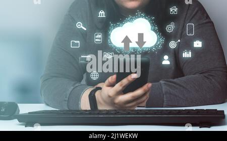 Woman using smartphone with cloud interface concept. Computing diagram. Internet of things. Data storage. Networking and internet service. Stock Photo