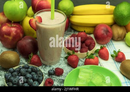 Delicious fruit smoothie made from fresh fruits. A glass of freshly made smoothie. Background with copy space Stock Photo