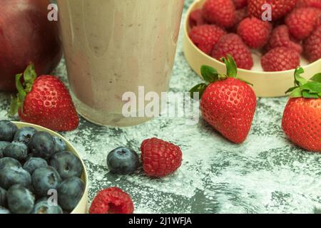 Delicious fruit smoothie made from fresh fruits. A glass of freshly made smoothie. Background with copy space Stock Photo