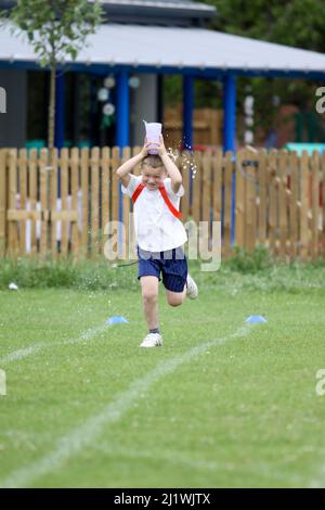 Running races at primary school sportsday Stock Photo