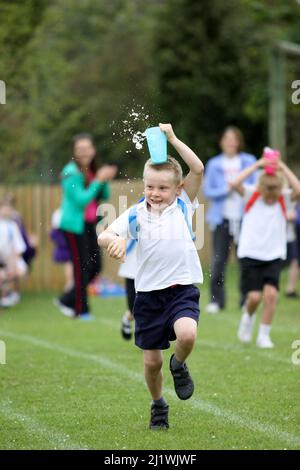 Running races at primary school sportsday Stock Photo