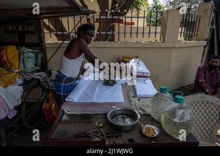 Man ironing clothes hi-res stock photography and images - Alamy