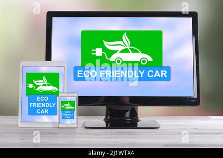 Eco friendly car concept shown on different information technology devices Stock Photo
