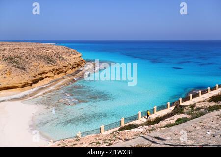 Marsa Matrouh. 27th Mar, 2022. Photo taken on March 27, 2022 shows the scenery of Ageeba Beach at the north coast city of Marsa Matrouh, Egypt. Marsa Matrouh, a resort city on the coast of the Mediterranean Sea, is famous for its soft white sandy beaches and transparent sapphire-color sea water. Credit: Sui Xiankai/Xinhua/Alamy Live News Stock Photo