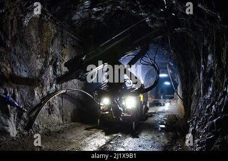 Jumbo Drill Posing at Underground Mine Stock Photo