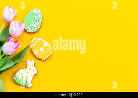 Happy Easter with pink tulips and cookies. Easter background Stock Photo