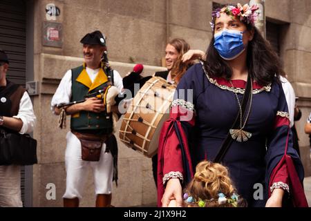 Vigo, Galicia, Spain, March 26 2022: A mother is dancing with her daughter in a history and folk music festival in Galicia Stock Photo