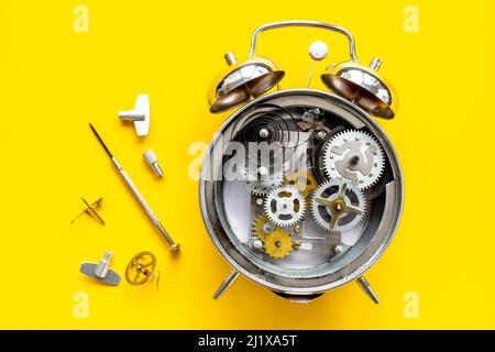 Watch mechanism with gears and wheels close up. Alarm clock mechanism Stock Photo