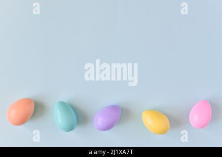 Easter postcard with bed-colored eggs with a copy of the place for the text. Stock Photo