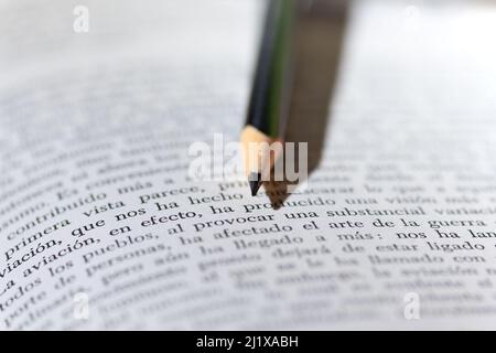 SCHOOL SUPPLIES. OPEN CHECKERED NOTEBOOK. OTHER CLOSED NOTEBOOKS, COLORED PENS. Stock Photo