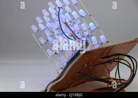 LED cube light project built using many blue light-emitting diodes and other simple electronic components in working on the testing laboratory Stock Photo