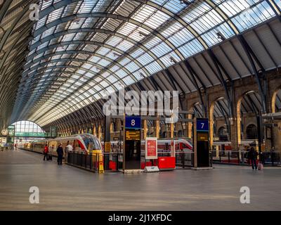 Platforms 7 and 8 of London King's Cross station on a sunny day. London. UK Stock Photo