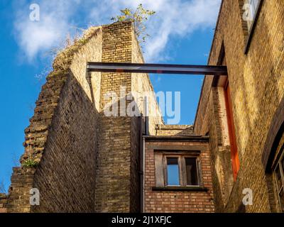 Exposed metal beam supporting an external building wall in Torrens Street. London UK. Stock Photo