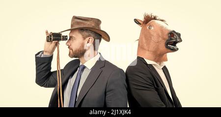 Staring into the distance. Weird businessmen. Corporate costume party. Corporate Halloween Stock Photo