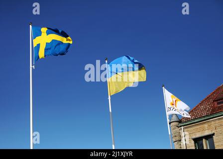 The Swedish flag and the Ukrainian flag the during Saturday in Vadstena, Sweden. Stock Photo