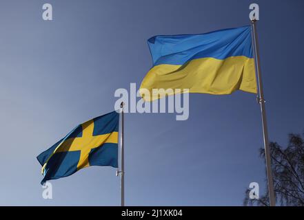 The Swedish flag and the Ukrainian flag the during Saturday in Vadstena, Sweden. Stock Photo