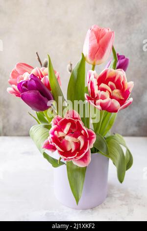Bouquet of pink and purple tulips. Mother's day holiday concept. Stock Photo