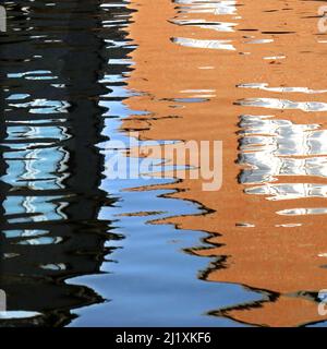 Abstract photograph, a play on light showing reflected pattern, line, shape and a varied colour pallette with light forms created by the gentle moveme Stock Photo