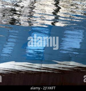 Abstract photograph, a play on light showing reflected pattern, line, shape and a varied colour pallette with light forms created by the gentle moveme Stock Photo