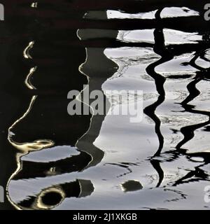 Abstract photograph, a play on light showing reflected pattern, line, shape and a varied colour pallette with light forms created by the gentle moveme Stock Photo