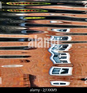 Abstract photograph, a play on light showing reflected pattern, line, shape and a varied colour pallette with light forms created by the gentle moveme Stock Photo