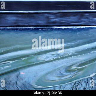 British waterway abstract photograph showing reflected pattern, texture, shape, and movement, with a colour pallette showing in light forms of mirrore Stock Photo