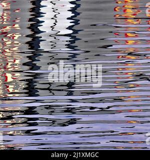 British waterway abstract photograph showing reflected pattern, texture, shape, and movement, with a colour pallette showing in light forms of mirrore Stock Photo