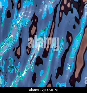 British waterway abstract photograph showing reflected pattern, texture, shape, and movement, with a colour pallette showing in light forms of mirrore Stock Photo