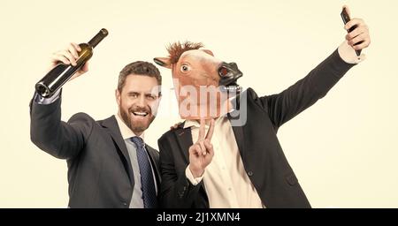 Live stream from anywhere. Happy businessmen take selfie video on smartphone. Live stream video Stock Photo